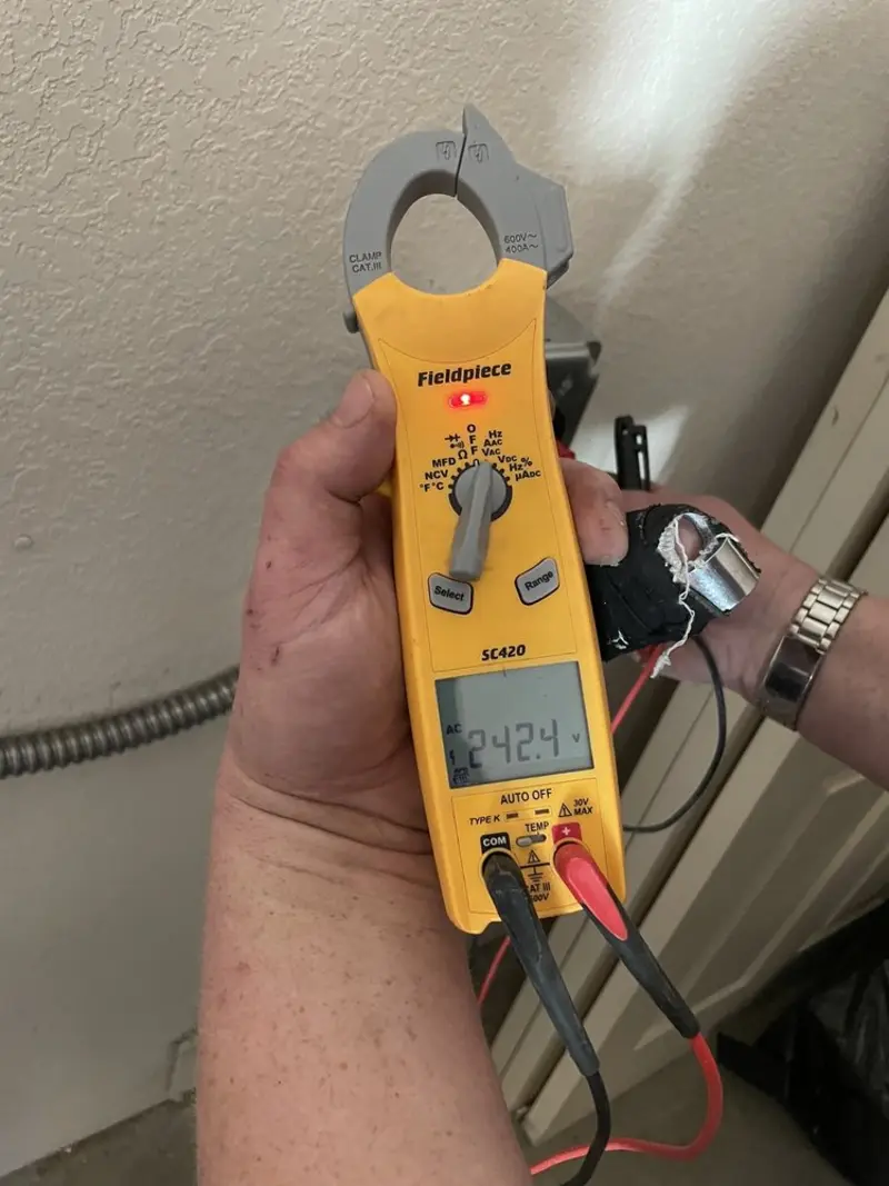 Voltage testing with clamp meter during Electrical Installation Services in Orange Beach